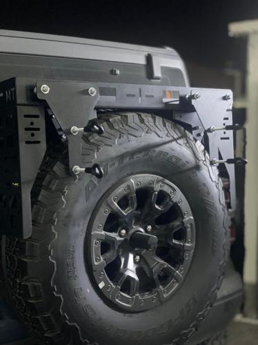 Traction board brackets on tire shlef
